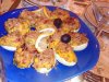 Как запечь фаршированные яйца под сыром?